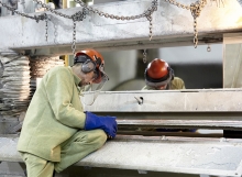 Steel Workers Inspecting Product