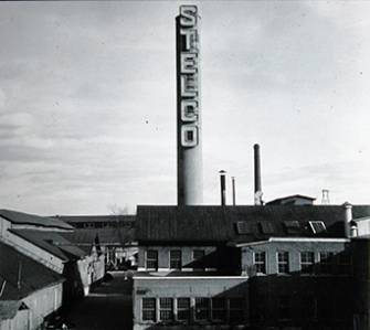 Our History - A Black and White Photo of a Smoke stack with White STELCO letters on it from the 1930s